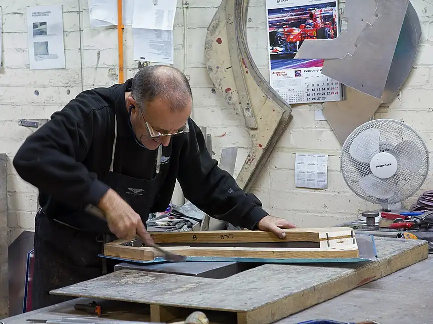 A craftsman at work inside the Morgan car factory in Malvern, England, in February 2013.